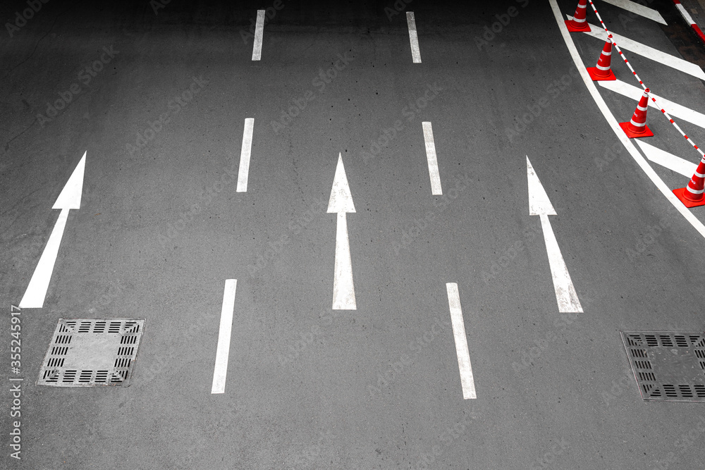3 lanes asphalt road with direction sign arrow during no car. 3 lanes asphalt road with direction sign arrow during no car.