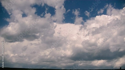 Wallpaper Mural Cumulus clouds float across a clear blue sky. storm and rain clouds at sunset. cloudy weather. Torontodigital.ca