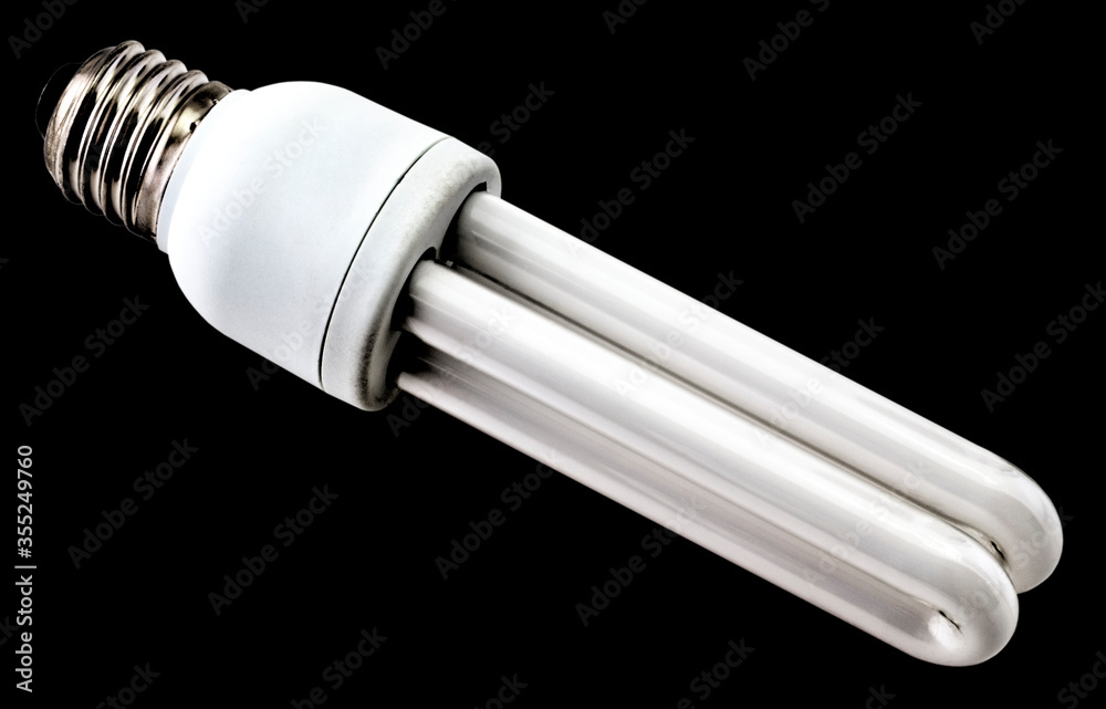 Energy saving bulb isolated on black background close up view Energy saving bulb isolated on black background close up view