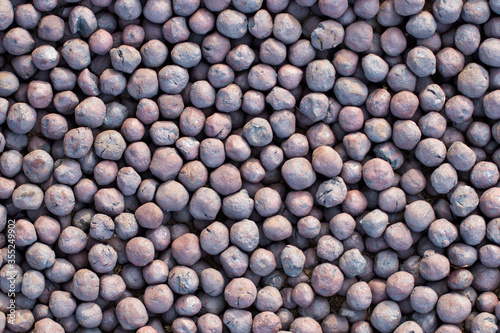 Seamless abstract background of expanded clay or balls of iron ore.