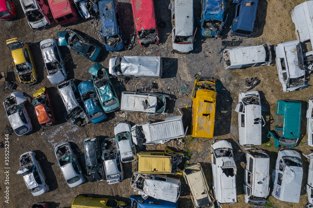 Scrapyard Aerial View. Old rusty corroded cars in car junkyard. Car recycling industry from above. Scrapyard Aerial View. Old rusty corroded cars in car junkyard. Car recycling industry from above.