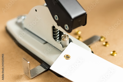 Принти на полотні Tool or manual machine for installing the eyelet
