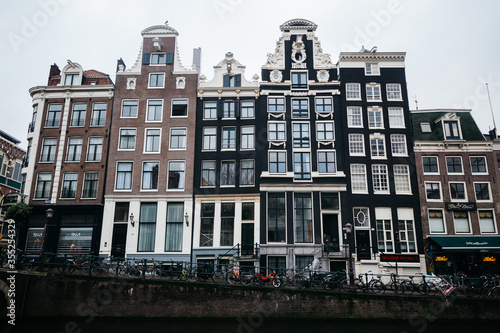 Beautiful houses on the waterfront in Amsterdam. Lots of bikes in the Netherlands.