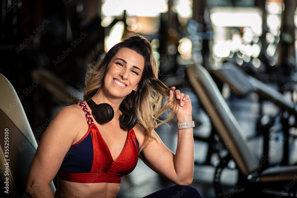 Happy fitness woman in gym Happy fitness woman in gym