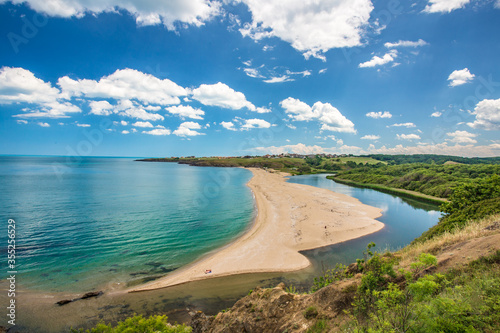 Fototapeta Naklejka Na Ścianę i Meble -  A beach at the mouth of the Veleka river.Sinemorets is a village and seaside resort on the Black Sea coast of Bulgaria, located in the very southeast of the country close to the border with Turkey