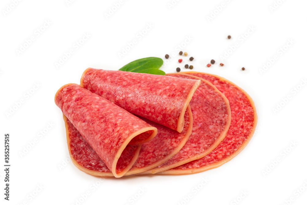 Salami slices isolated on white background. Salami slices isolated on white background.