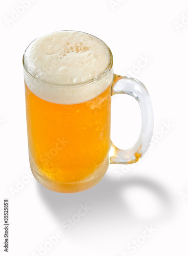 Beer in mug or glass, cool draught beer has white Soft beer bubble overflowing glass, on isolated white background for design element and copy space.