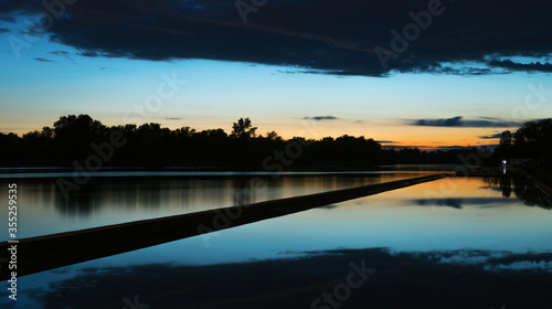 Blue sunset sky reflected in the water