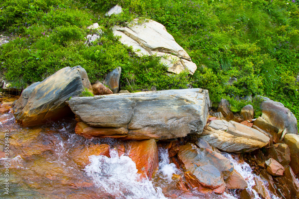 Rock and stone close-up and texture. Nature background, rock texture, river water. Rock and stone close-up and texture. Nature background, rock texture, river water.