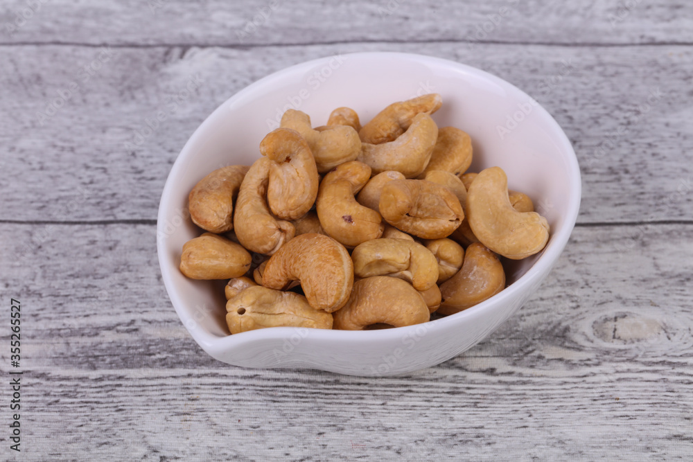 Cashew nuts heap in the bowl Cashew nuts heap in the bowl