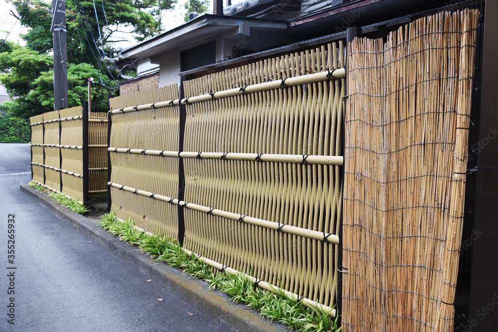 A Japanese style hedge made of artificial bamboo. A Japanese style hedge made of artificial bamboo.