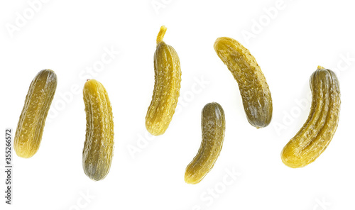 Top view of pickled cucumbers isolated on a white background. Cornichons - small pickled cucumbers.