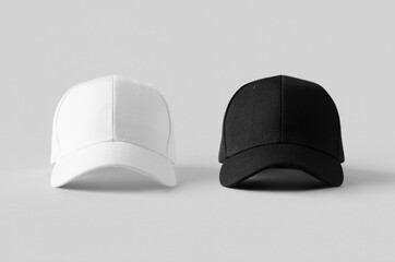 White and black baseball caps mockup on a grey background, front view.