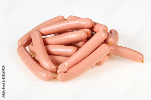Tasty meat sausages over white background