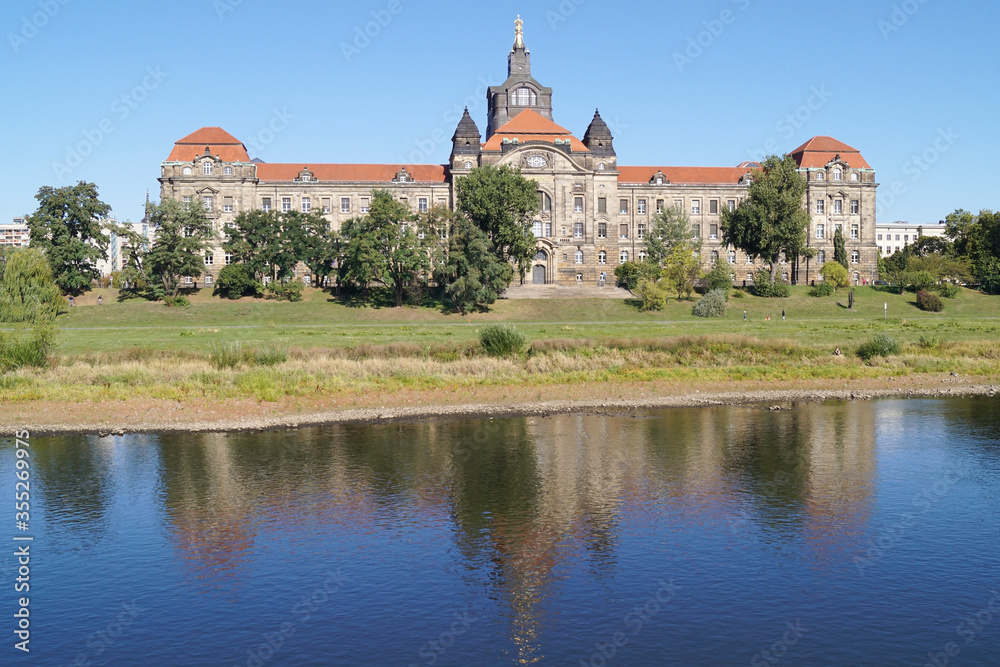 The Sächsische Staatskanzlei seen from the Elbe. The Saxon state chancellery is the office of the Minister-President of Saxony. The Sächsische Staatskanzlei seen from the Elbe. The Saxon state chancellery is the office of the Minister-President of Saxony.