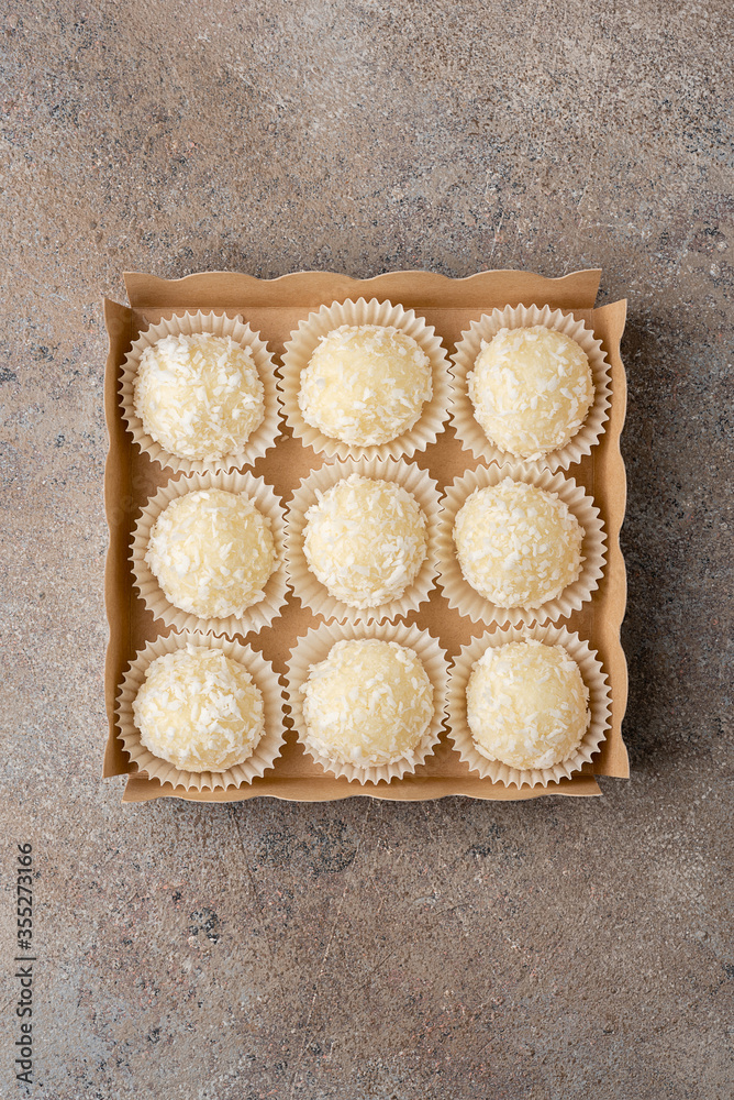 Set of coconut truffles made of white chocolate, cream and coconut. Set of coconut truffles made of white chocolate, cream and coconut.
