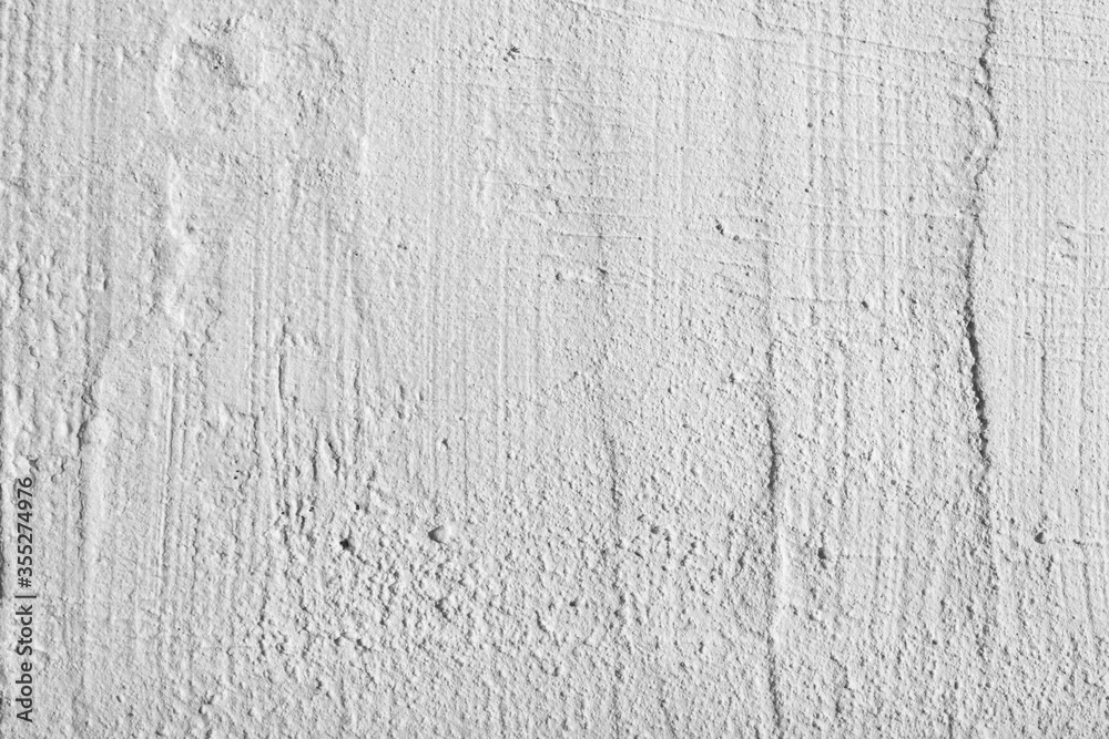 White plaster texture on an uneven surface White plaster texture on an uneven surface