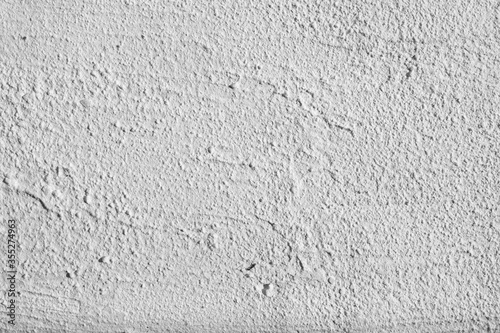 White plaster texture on an uneven surface