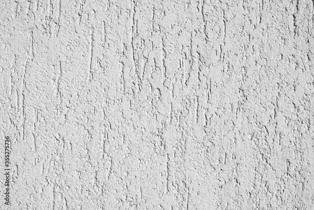 White plaster texture on an uneven surface