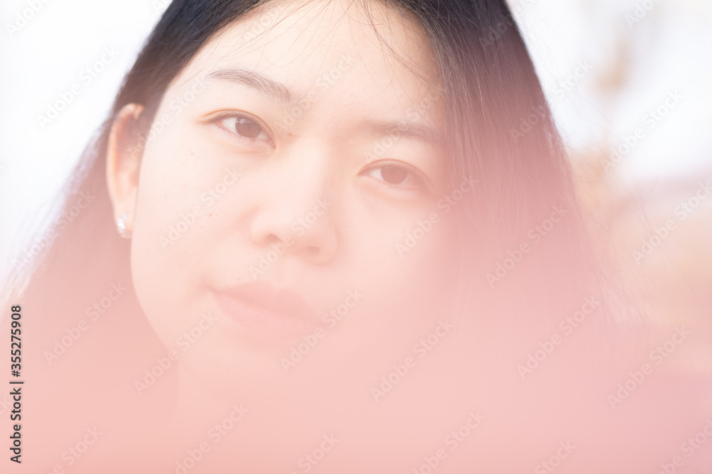 Soft Focus Background Of An Attractive Asian Woman Looking At The Camera Soft Focus Background Of An Attractive Asian Woman Looking At The Camera