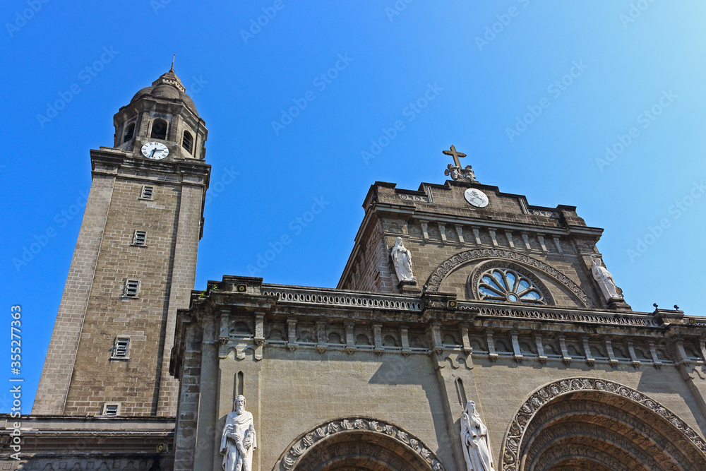 Fragment facade and top parts of Manila Cathedral or The Minor Basilica and Metropolitan Cathedral of the Immaculate Conception in historic walled city of Intramuros, Philippines