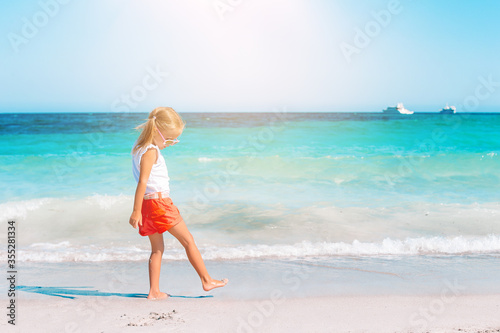 Wallpaper Mural Adorable little girl at beach during summer vacation Torontodigital.ca