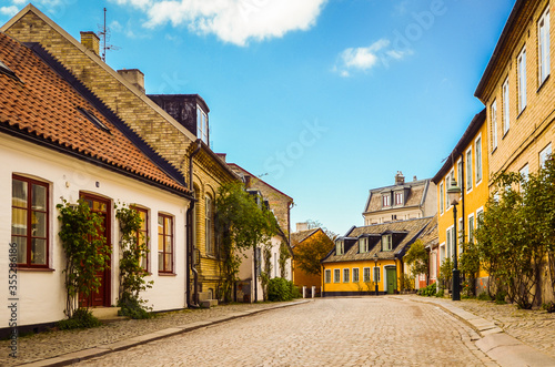 Street with old buildings in the downtown of Lund, Sweden - by itsflowingtothesoul photo