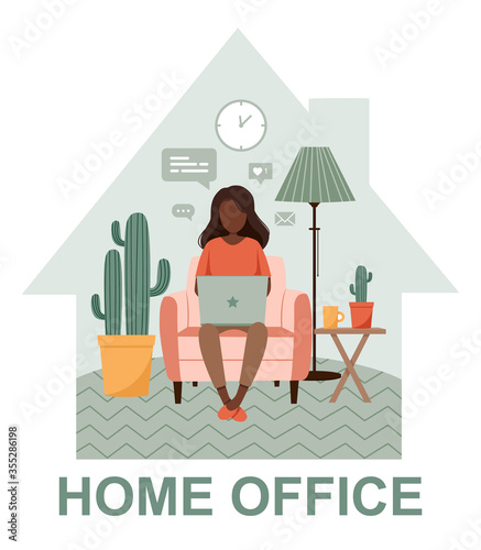 Dark skinned woman with laptop on the chair. Freelance or studying staying home. Young girl working from home. Self-isolation shield from coronavirus. Remote work from home during Quarantine. 