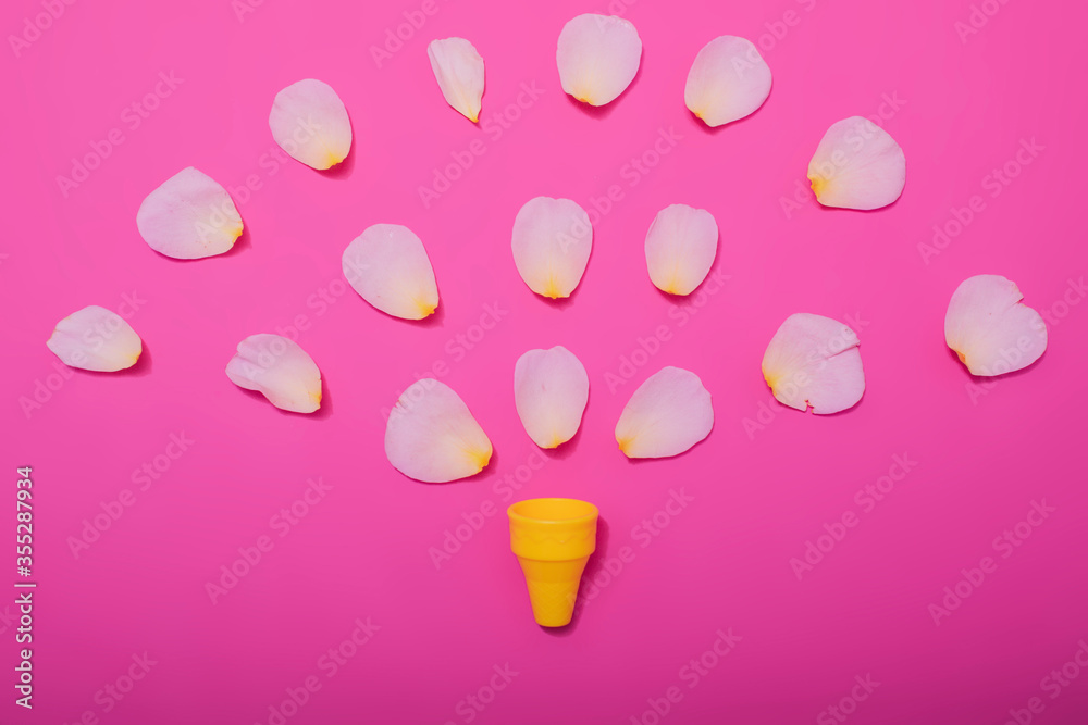 Summer minimal concept. Ice cream cone with rose leaves on punchy pastel background. Flat lay. Top view. Creative layout. Summer minimal concept. Ice cream cone with rose leaves on punchy pastel background. Flat lay. Top view. Creative layout.