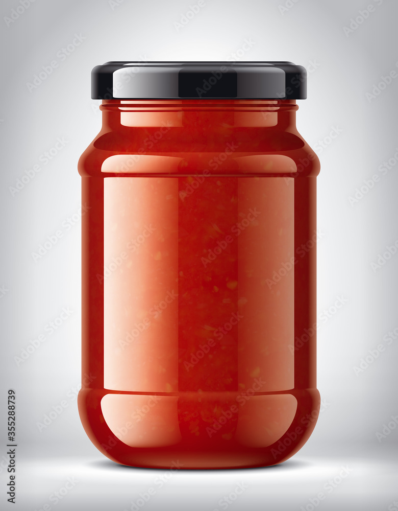Glass Jar on Background with Tomato Sauce Glass Jar on Background with Tomato Sauce