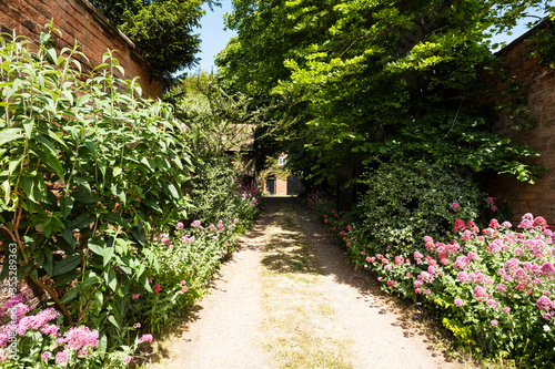 Private driveway with lined with flower beds