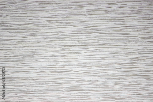 Gray background. Gray horizontal stripes of exterior wall panels.