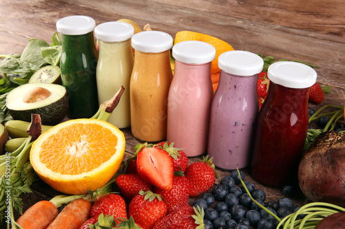 Multicolored smoothies and juices from vegetables, greens, fruits and berries, food background. Detox and dieting, clean eating, healthy lifestyle concept
