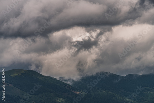 Mysterious black mountain with dramatic cloudy sky