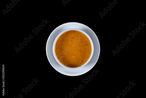 Red lentil soup. Top view. Cream-soup  ezo gelin soup isolated on black background