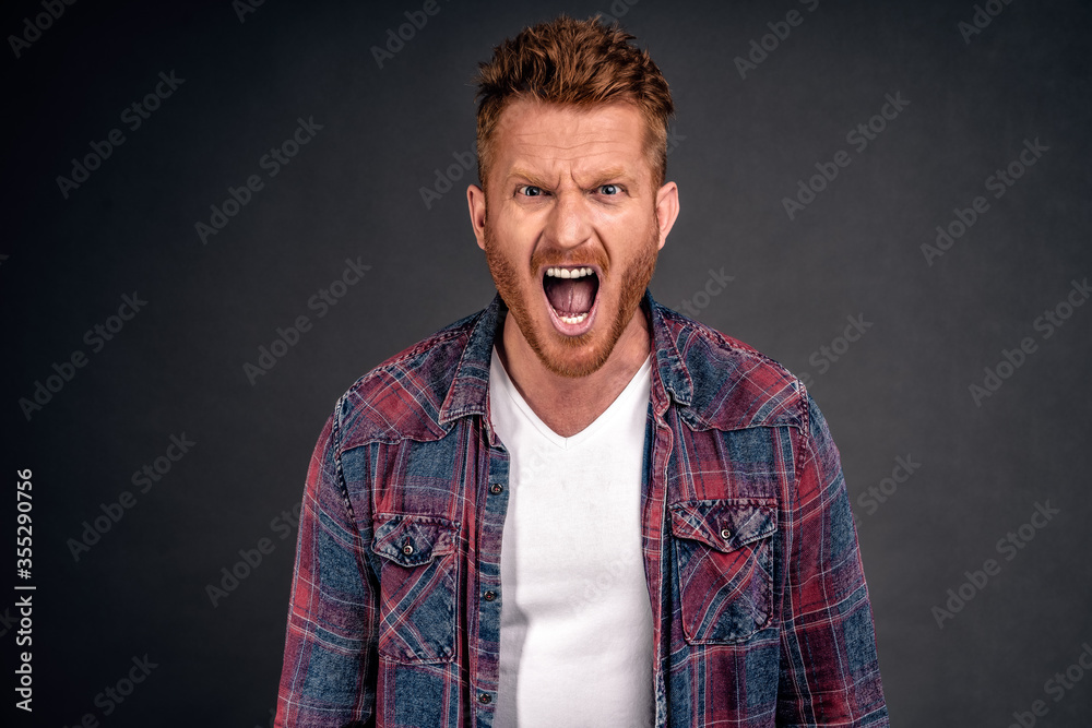 You cheated on me how could you. Upset outraged and unhappy redhead man with bristle, shouting, frowning making displeased expression, feeling pain in soul while having argumbent over grey wall You cheated on me how could you. Upset outraged and unhappy redhead man with bristle, shouting, frowning making displeased expression, feeling pain in soul while having argumbent over grey wall