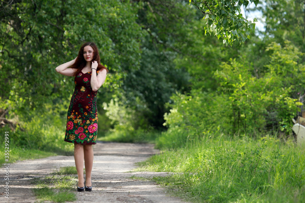 Portrait of brown haired woman outside 