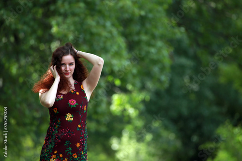 Portrait of brown haired woman outside 