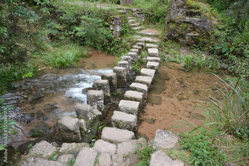 Bridge made from stones for people cross brook Bridge made from stones for people cross brook