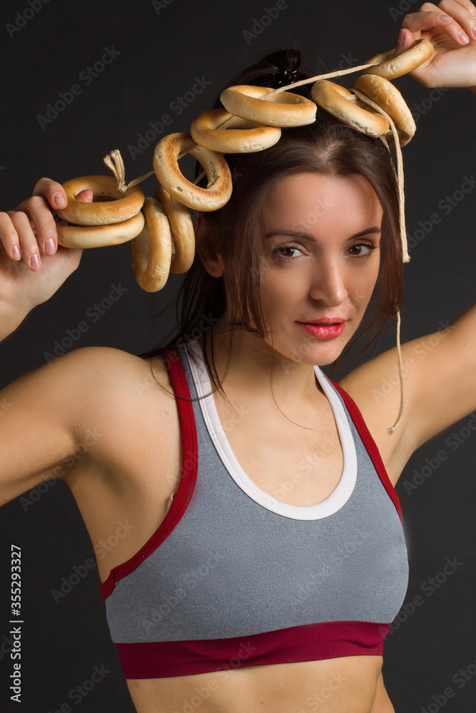 Studio portrait of a funny young woman in a sports top,