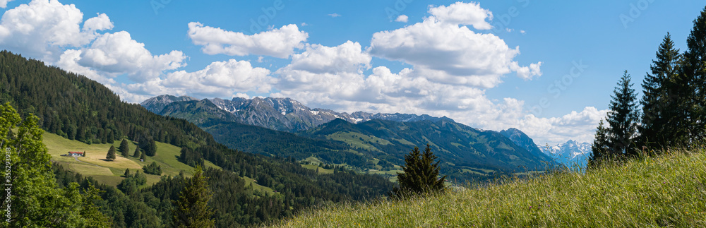 Panorama of the Bavarian Alps on a sunny-cloudy day in Allgäu, Germany