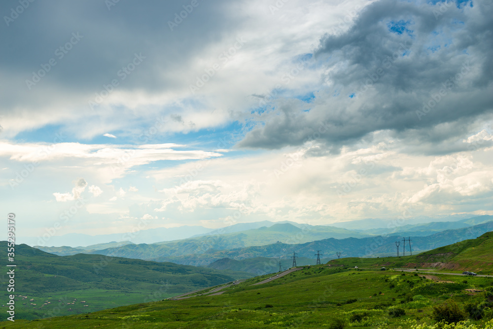 Panoramic view of the picturesque landscape of Armenia - mountains, fields and clouds