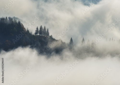 Predawn time in the highlands. mountain silhouettes in the fog