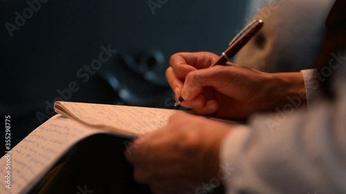 World Press Freedom Day. woman journalist  writing notes in notebook at desk.4k Video