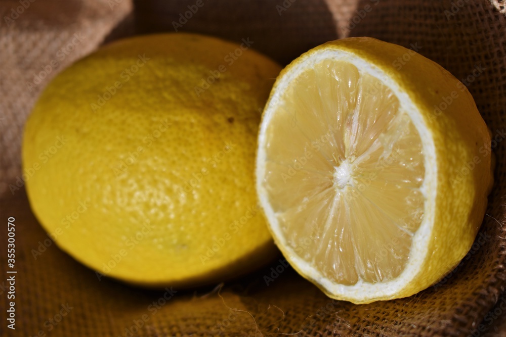 a yellow lemon on a jute fabric a yellow lemon on a jute fabric