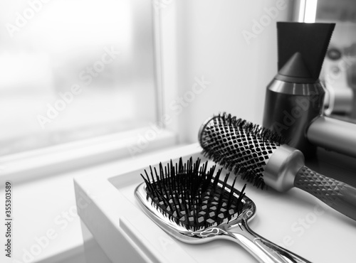 a set of hairdressing tools in the interior of a beauty salon black and white photo