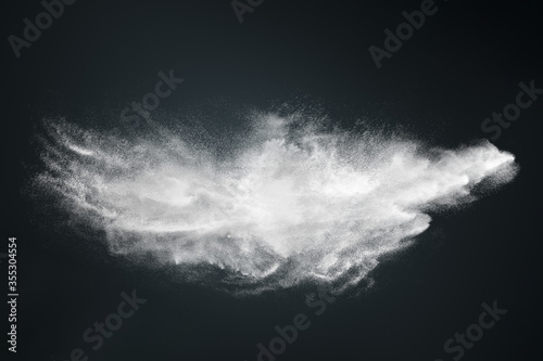 Abstract design of white powder cloud on dark background