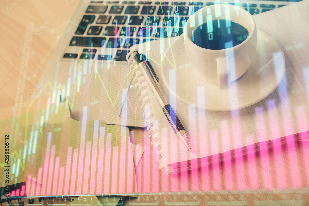 Double exposure of forex chart drawing and desktop with coffee and items on table background. Concept of financial market trading