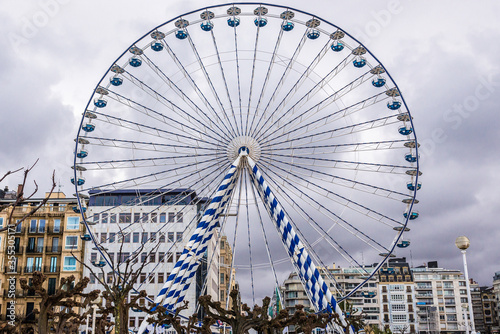Ferris wheel in Alderdi Eder park in historic part of San Sebastian city, Spain photo