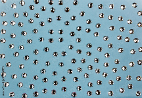 Crystals. Crystal strasses on a abstract Living blue background. Beautiful shiny sparkling silver rhinestones.